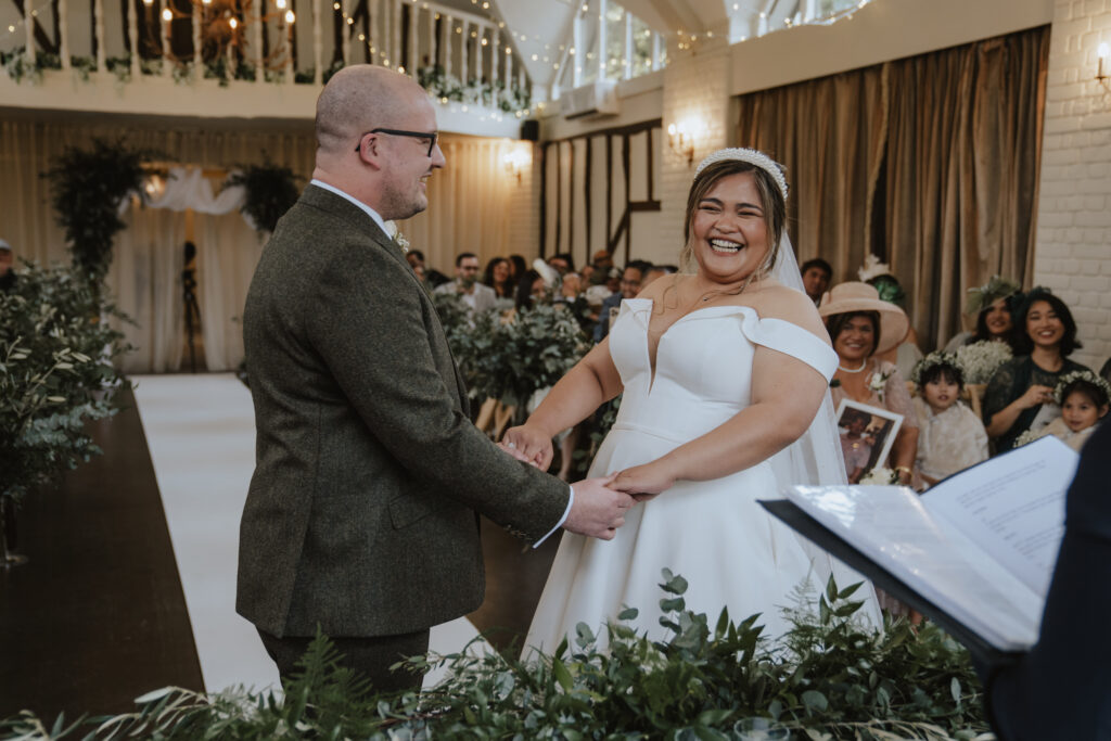 During Arlyn and Calvin's wedding ceremony at Seckford Hall in Suffolk