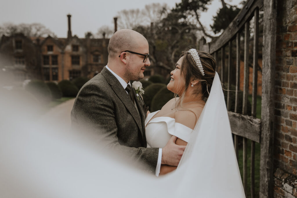 Couple's portraits at Seckford Hall in Suffolk