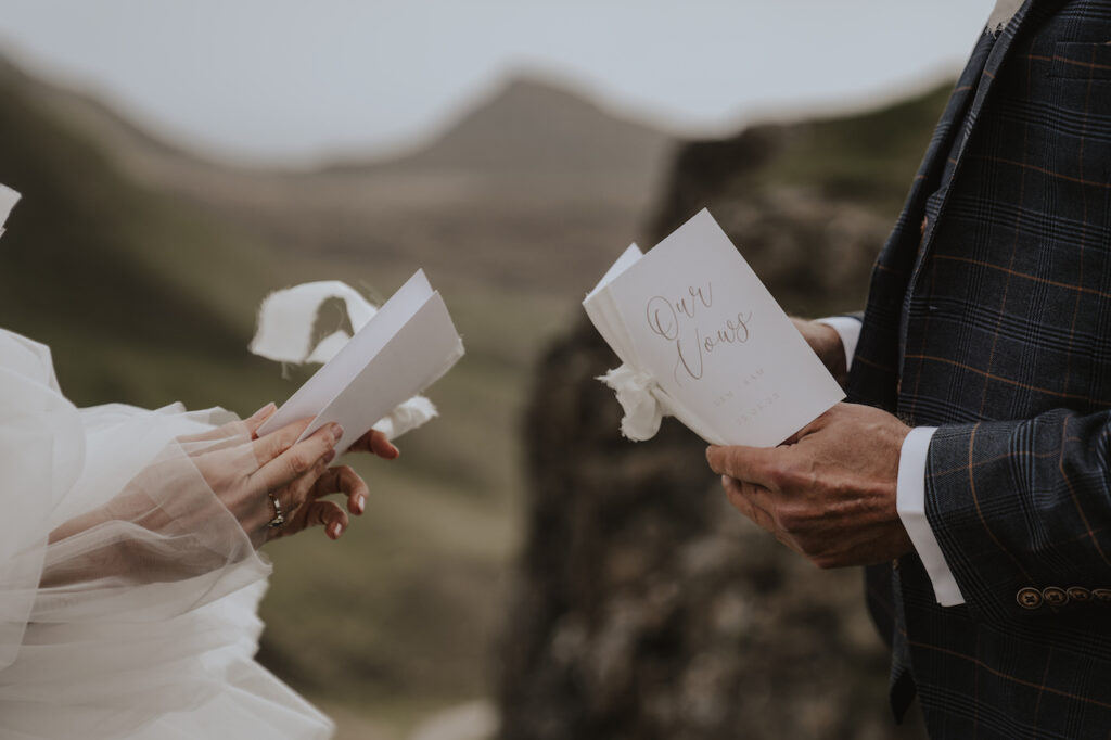 Private vow books during an intimate elopement ceremony at Quiraing on the Isle of Skye
