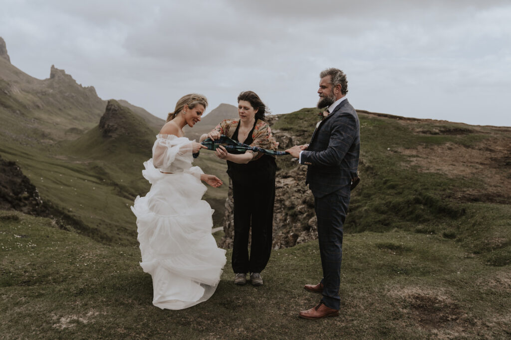 Elopement photographer on the Isle of Skye capturing a couple getting married overlooking Quiraing
