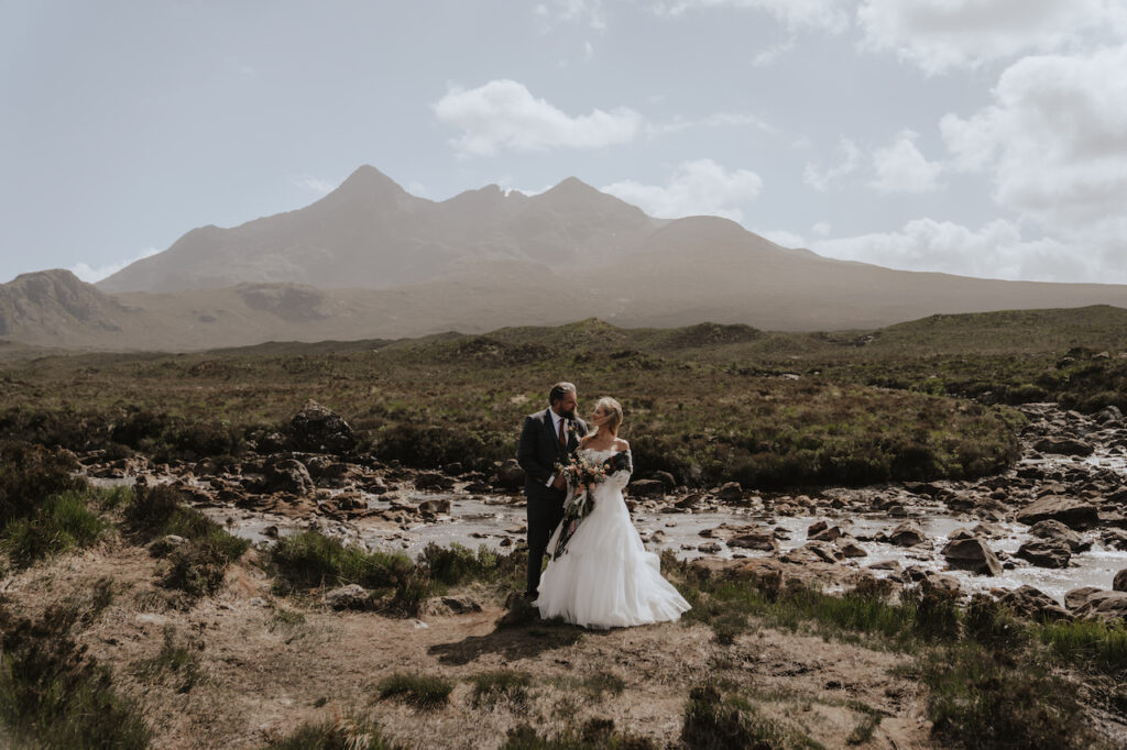 The Isle of Skye mountains whilst a couple elope