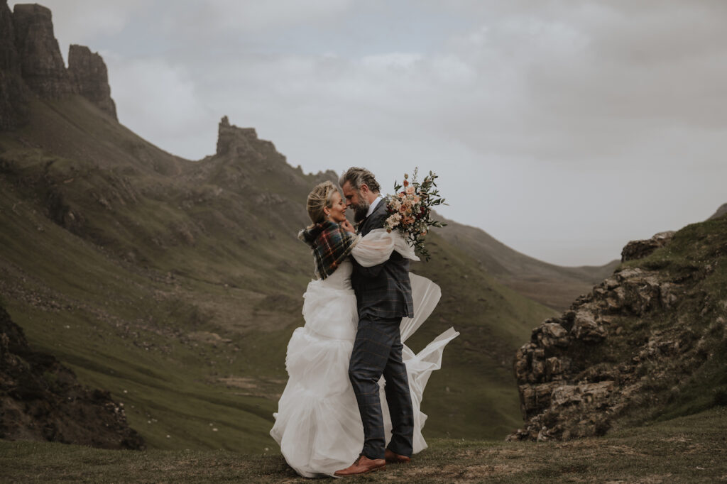 A couple eloping on the Isle of Skye overlooking Quiraing, Scotland