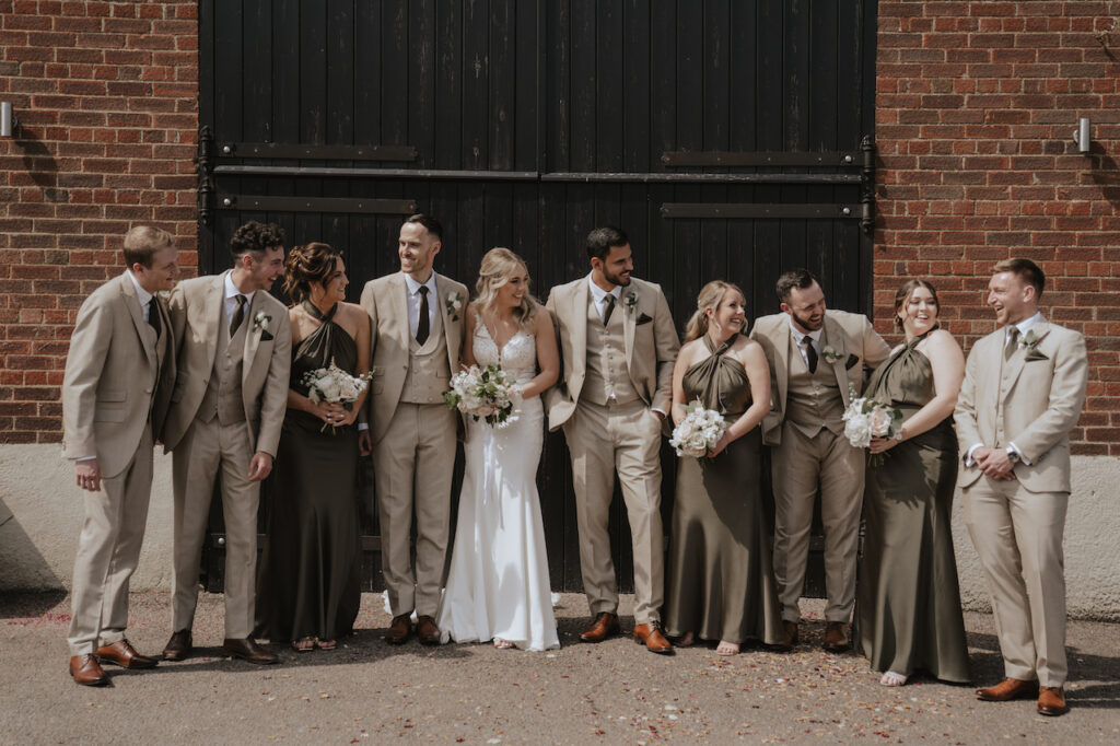 Wedding formal portraits outside the ceremony barn at Milling Barn