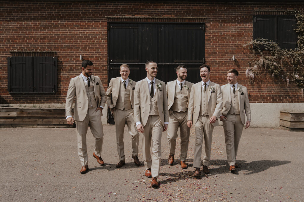 Wedding formal portraits outside the ceremony barn at Milling Barn in Hertfordshire