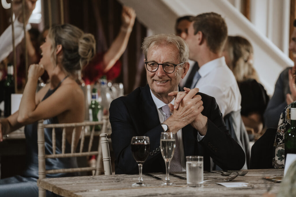 Candid moments during the wedding speeches at milling Barn