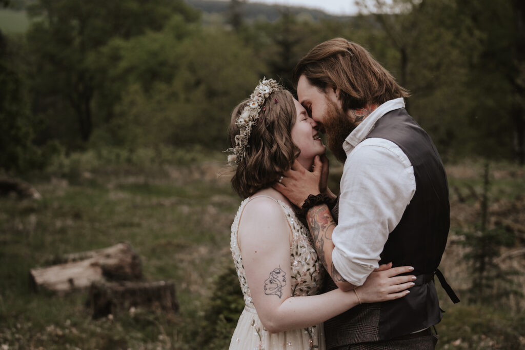 Newly married couple having wedding portraits in the Scotland countryside