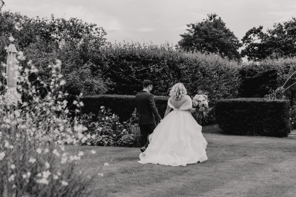 Moments after the outdoor ceremony in the gardens at Butley Priory