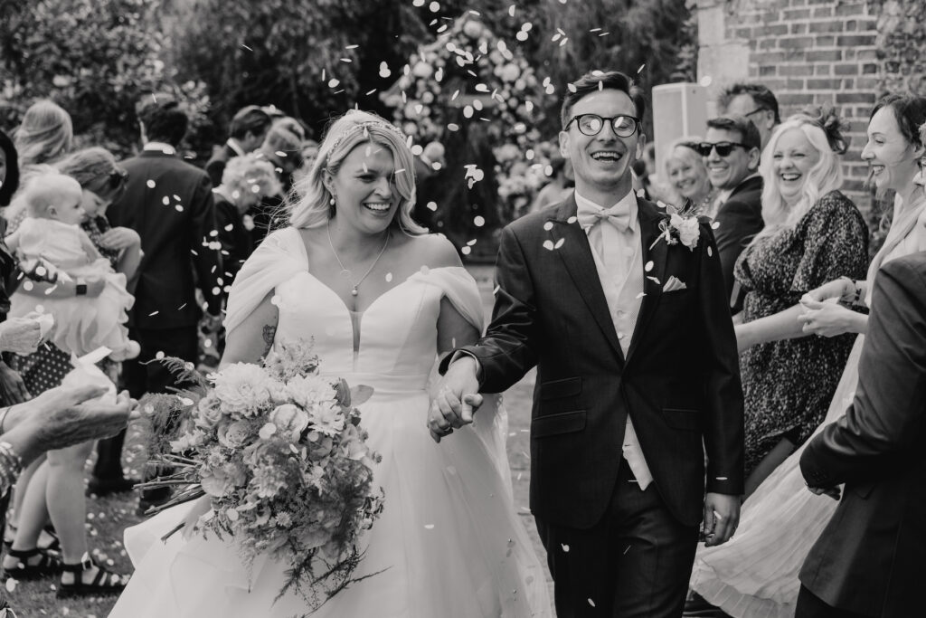 Confetti throwing during a wedding at Butley Priory in Suffolk