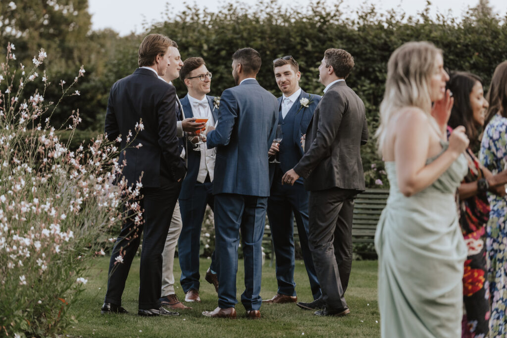 Candid moments during the drinks reception at Butley Priory