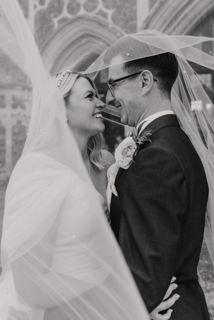 Wedding portraits under the veil at Butley Priory