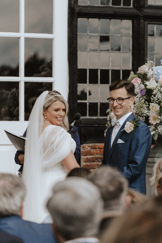 The couple during their outdoor ceremony at Butley Priory