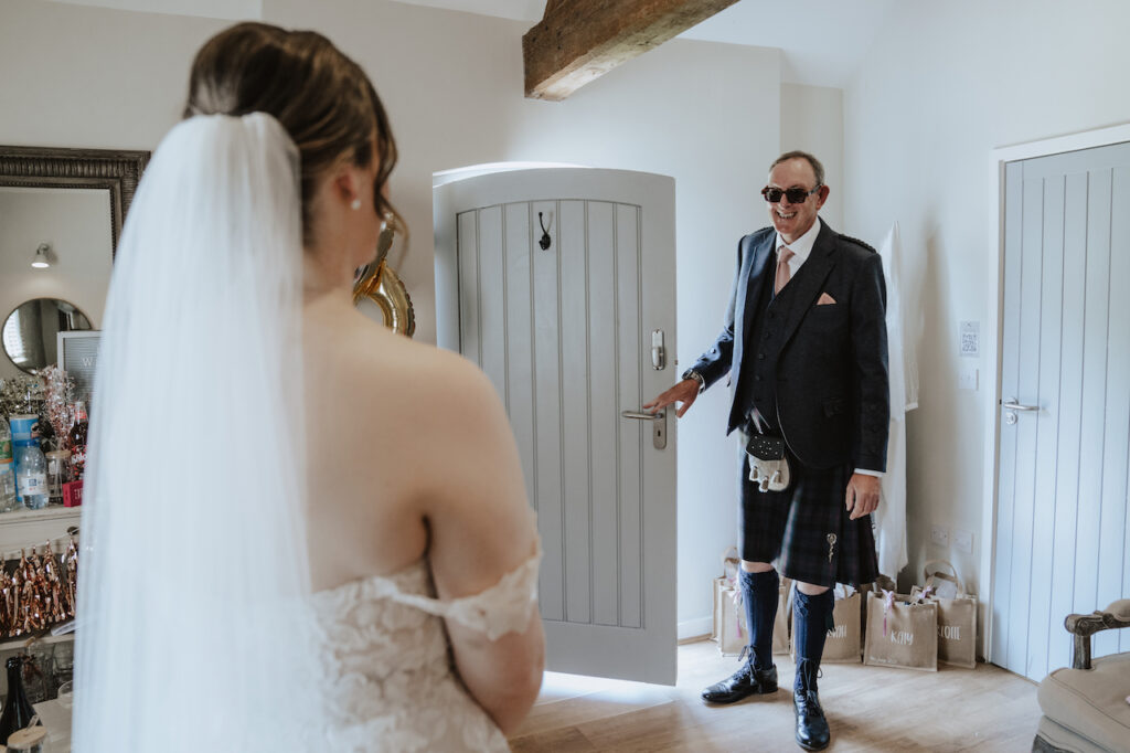 First look with Katy's dad during morning wedding preparations at Swallows Nest Barn
