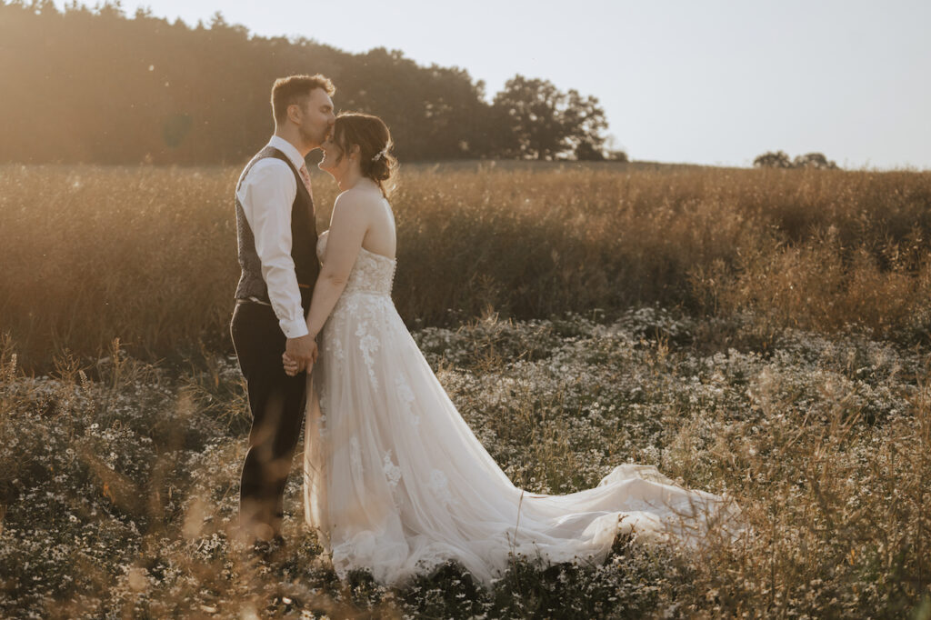 Evening couples portraits in the surrounding Midlands fields at Swallows Nest Barn