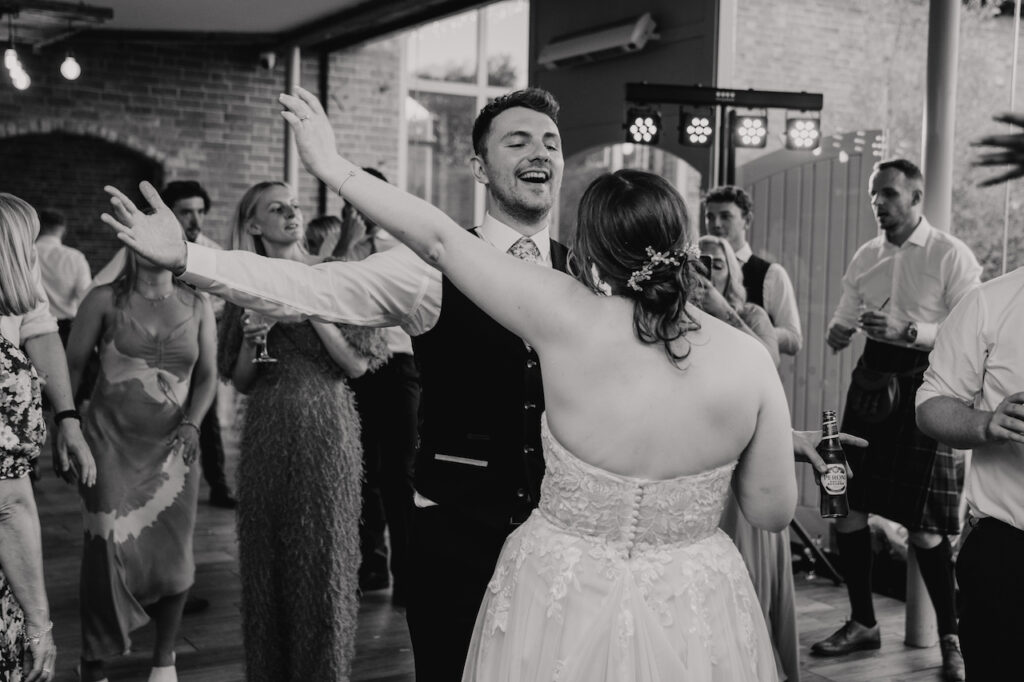 The couple dancing during their wedding party at Swallows Nest Barn