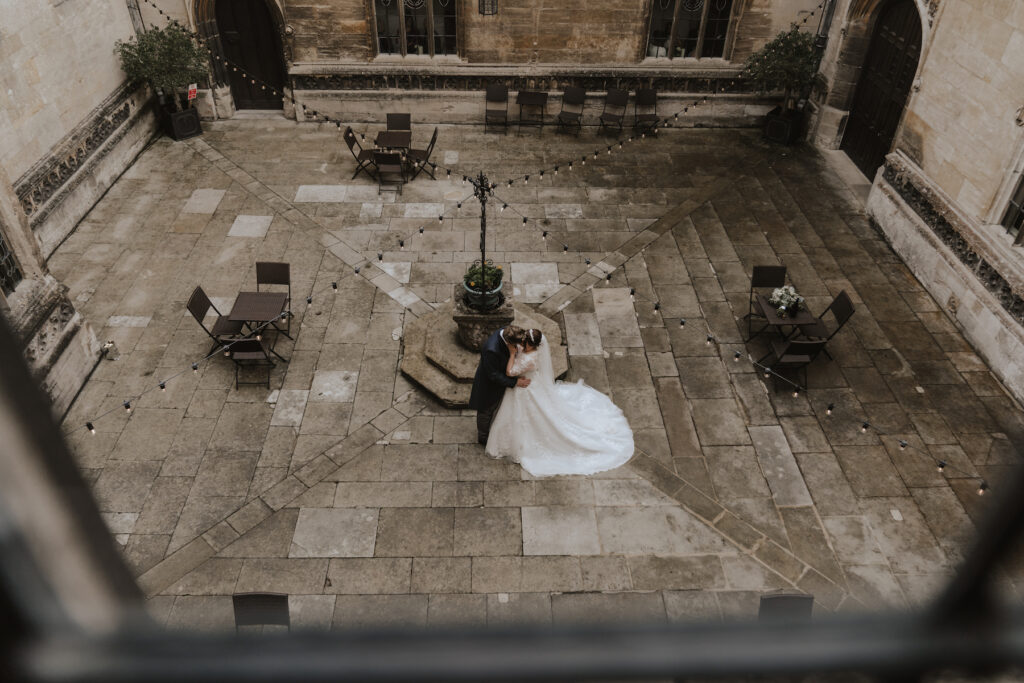 The couple stood in the courtyard of Hengrave Hall in Suffolk