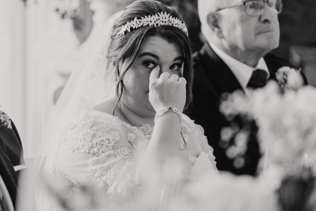 Candid speech reaction from the bride at Hengrave Hall