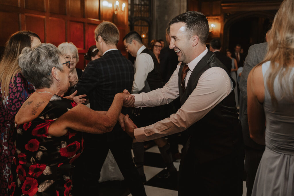 Suffolk wedding photographer capturing dance floor moments at Hengrave Hall