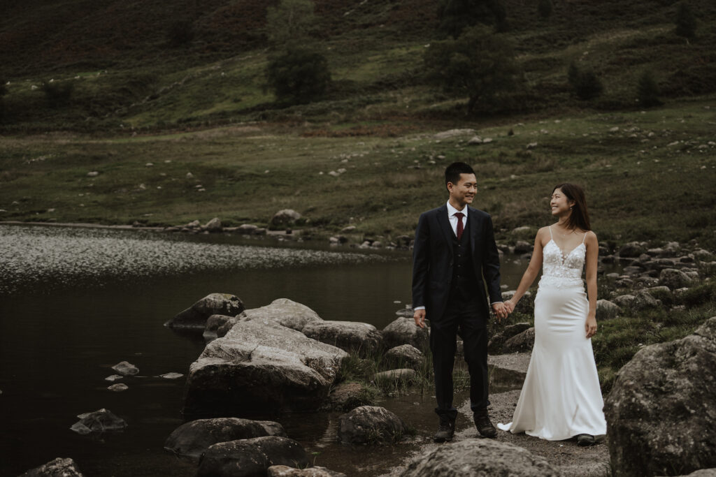 The couple hiking during their Lake District elopement