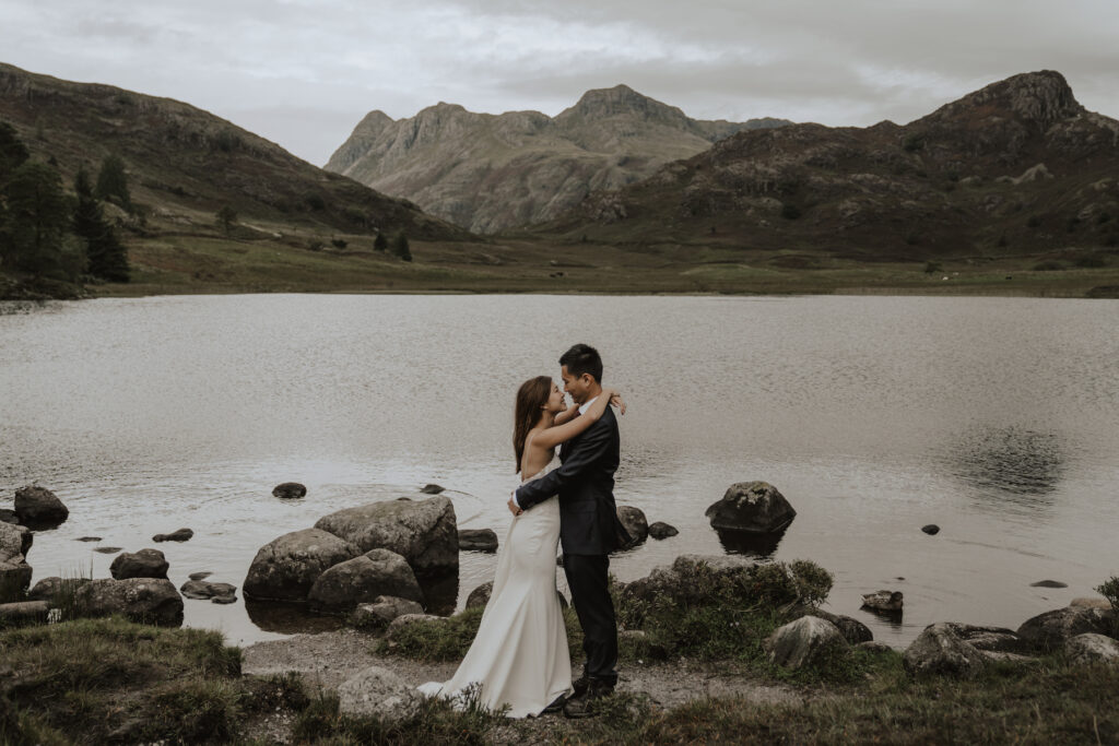 A couple eloping in The Lake District sharing their first kiss after their elopement ceremony