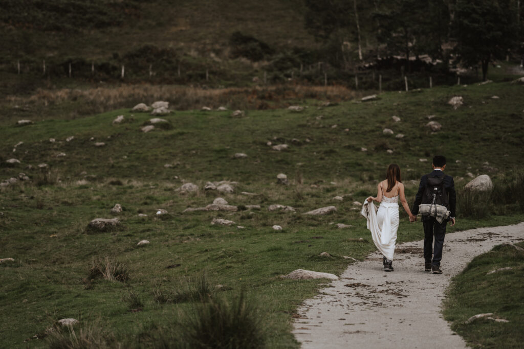 An eloping couple hiking in the Lake District during their elopement