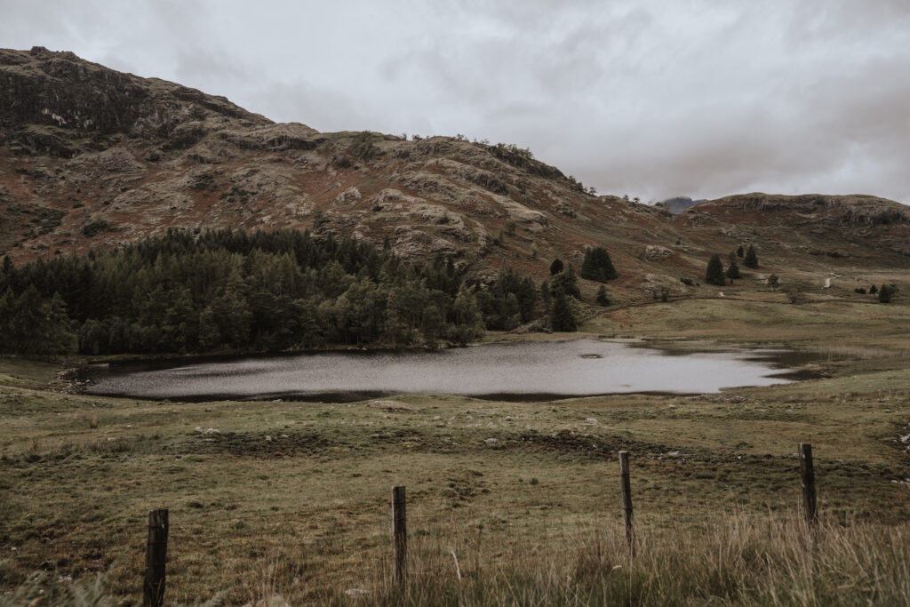 A hidden tarn during a couples elopement within the Lake District