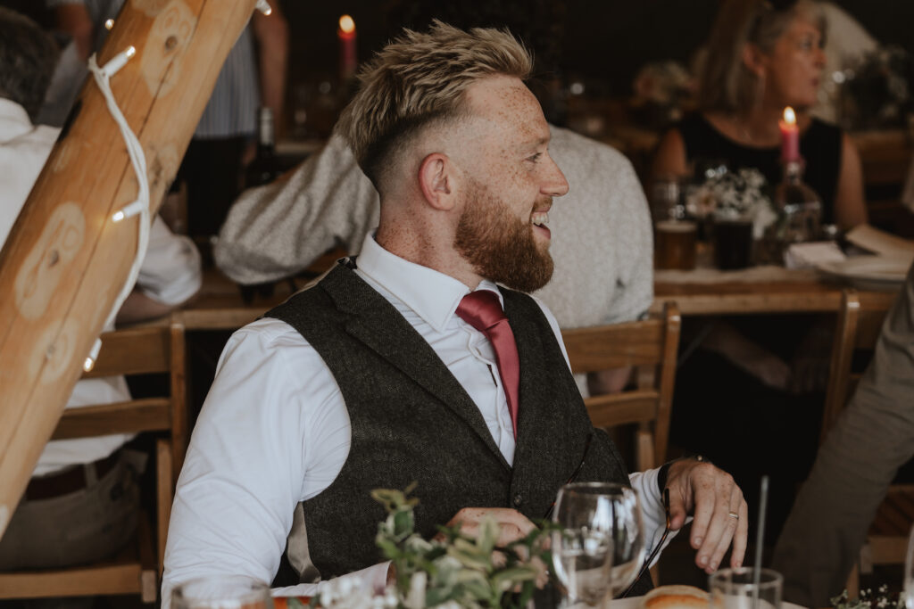 Candid moments during the speeches captured by a wedding photographer in the midlands