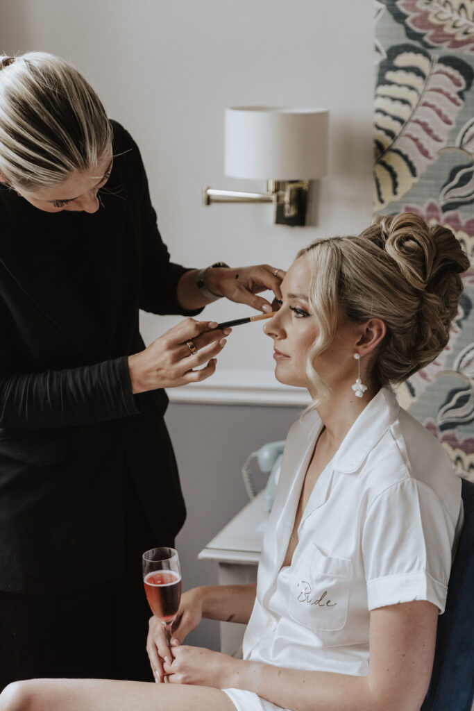 The bride getting her makeup done captured by a Yorkshire wedding photographer