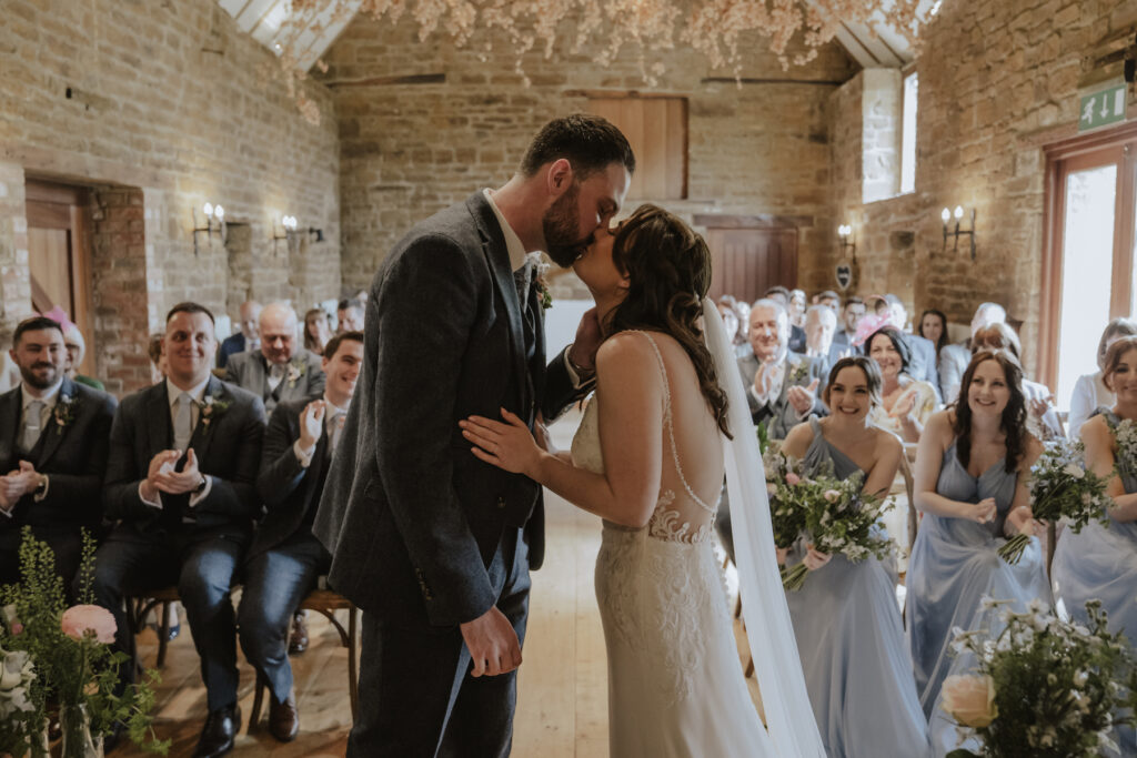 The first kiss during the ceremony at Crockwell Farm