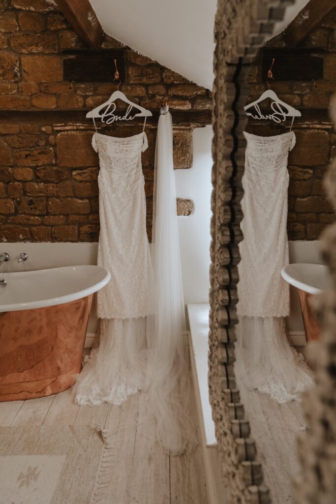 The brides dress hanging up in the bridal suite at Crockwell Farm