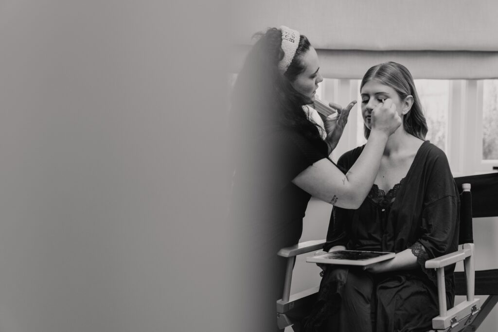 Bride getting ready in the bridal suite of Crockwell Farm in Northamptonshire