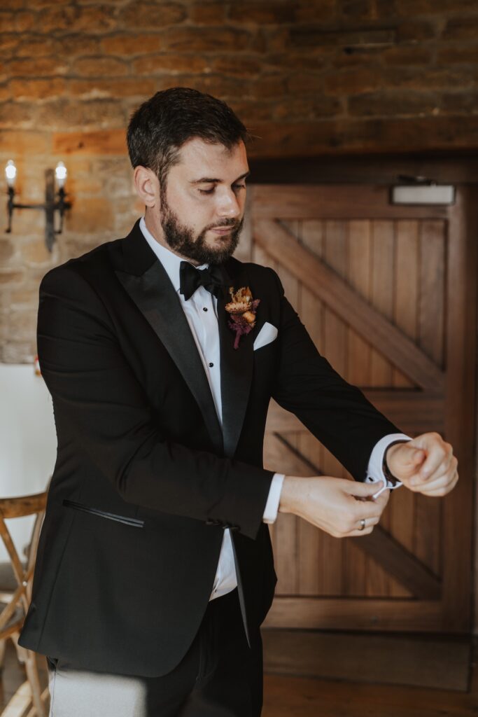 Grooms prep in the ceremony suite at Crockwell Farm in Daventry