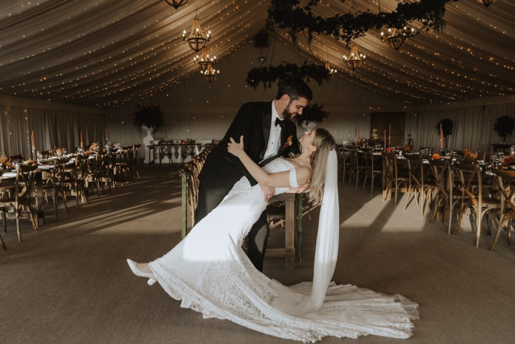 Indoor portraits of the couple in the wedding breakfast room at Crockwell Farm