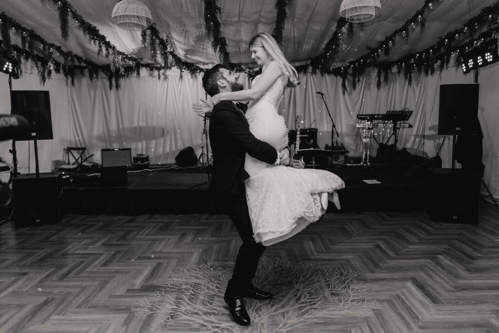 Northamptonshire wedding photographer capturing the first dance of a couple at Crockwell Farm