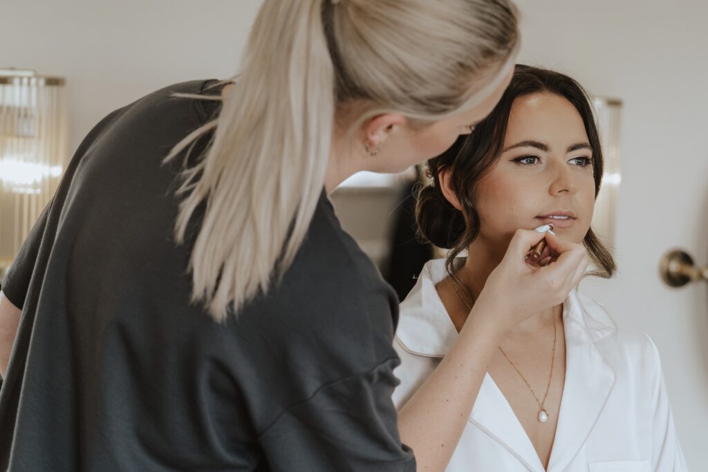 Maidens Barn wedding photographer capturing bridal prep in the morning of their wedding
