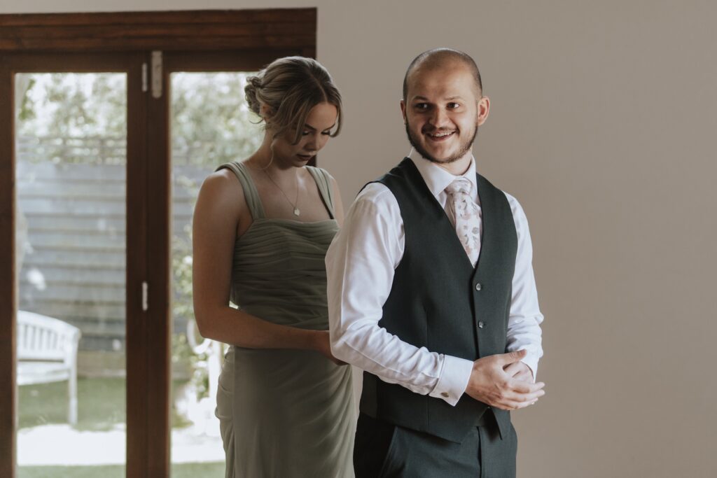 The groom getting ready in the morning of his wedding at Maidens Barn in Chelmsford