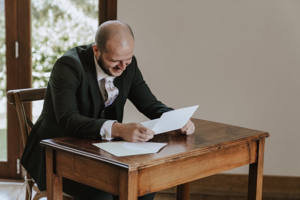 Essex wedding photographer capturing the groom at Maidens Barn in Essex