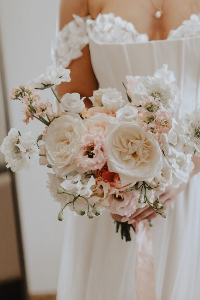 Bouquet details during morning prep at a wedding at Maidens barn in Chelmsford, Essex
