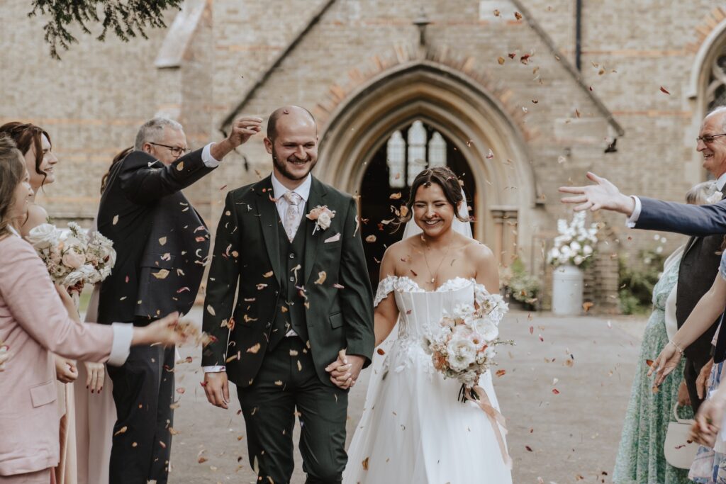 Confetti moments outside a Chelmsford church captured by an Essex wedding photographer