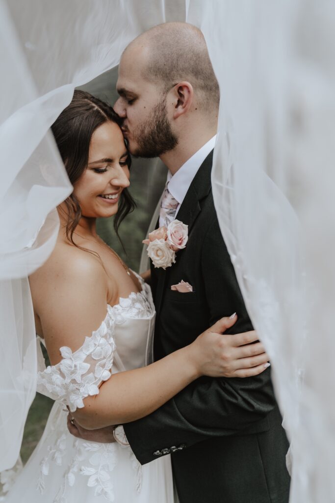 Wedding photographer in Essex capturing Maidens Barn couples portraits