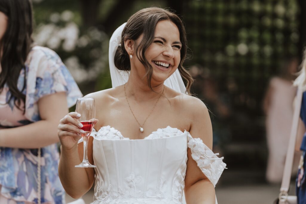 Essex wedding photographer capturing candids during a drinks reception at Maidens Barn in Chelmsford