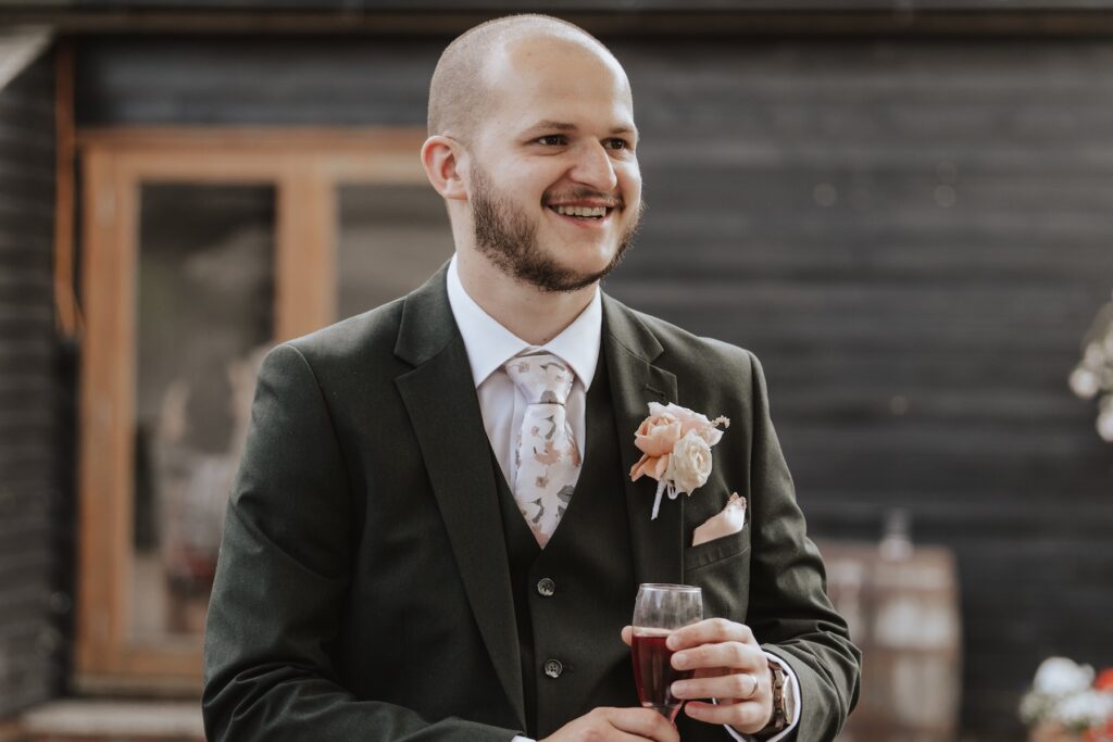 Essex wedding photographer capturing candids at Maidens Barn