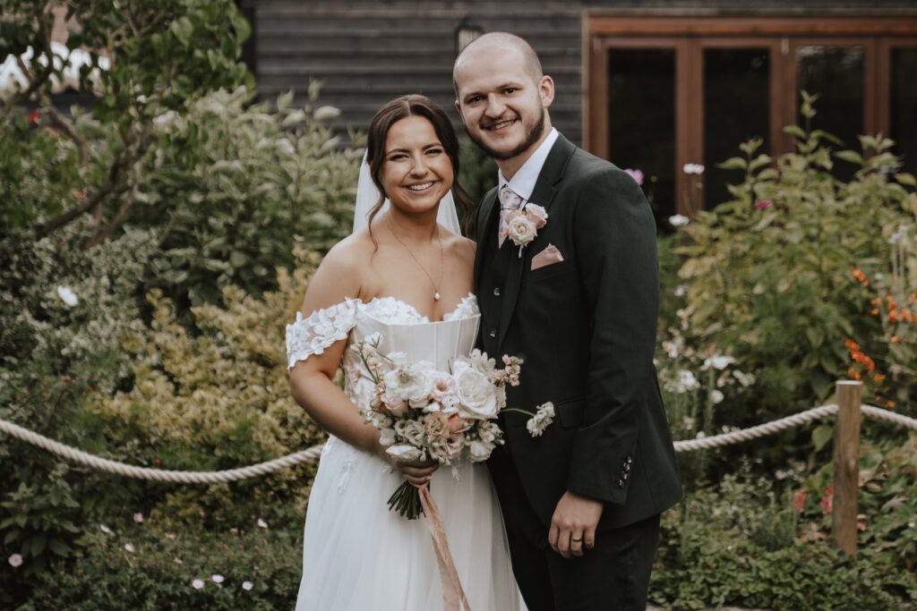 Formal photos during drinks reception at Maidens Barn in Essex