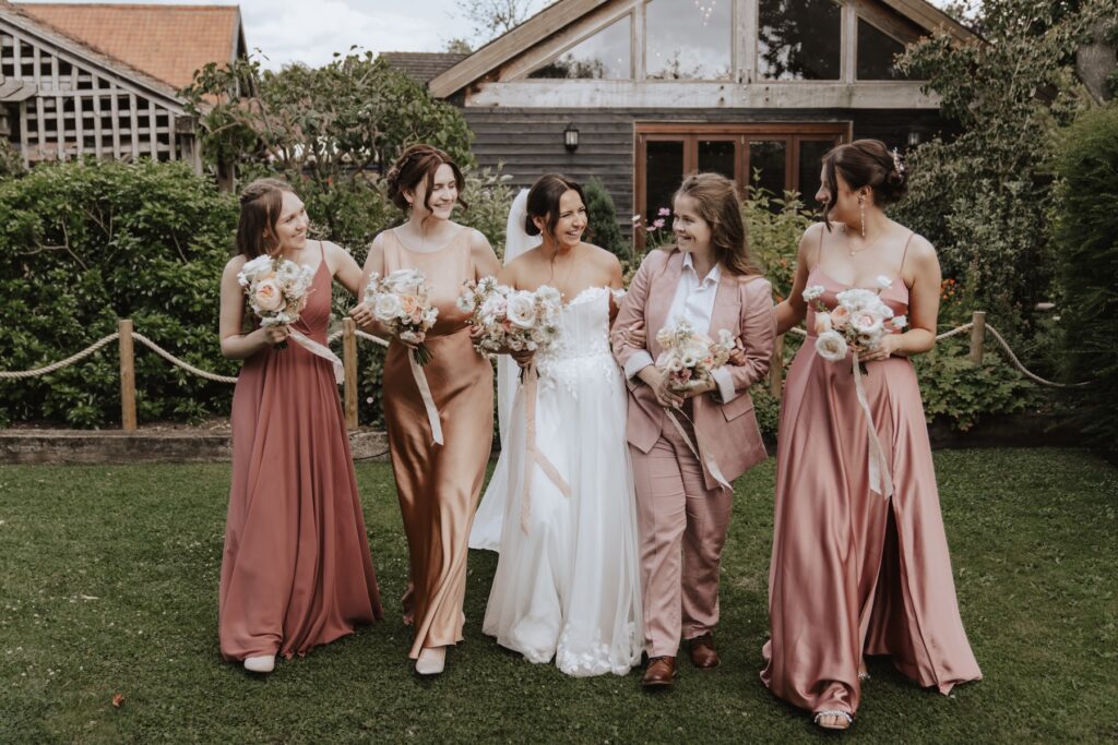 Candid formal photos during drinks reception at Maidens Barn captured by a wedding photographer in Essex