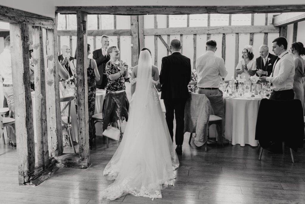 Candid moments captured by an Essex wedding photographer at Maidens Barn