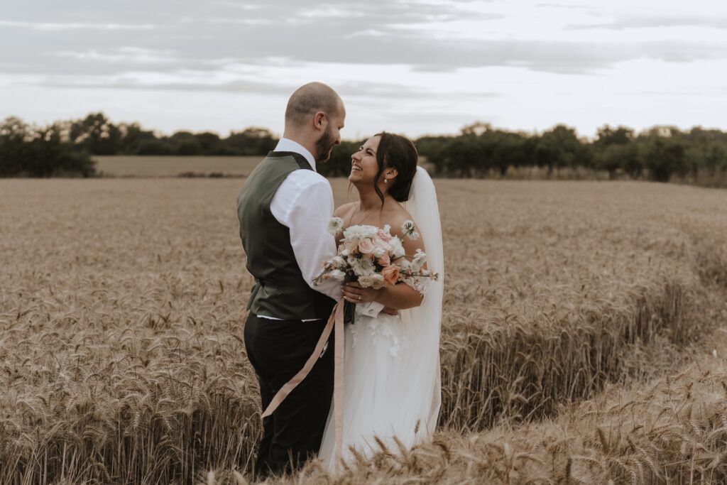 Essex wedding photographer capturing evening wedding portraits at Maidens Barn