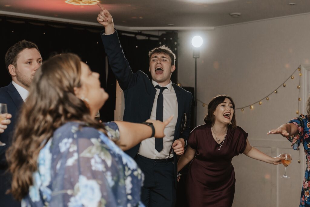 Dance floor at Maidens Barn in Essex captured by a Chelmsford wedding photographer