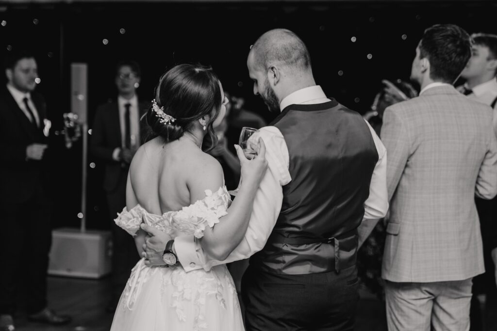 The couple on the dance floor at Maidens Barn captured by an Essex wedding photographer