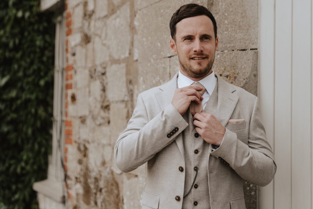 Pentney Abbey Norfolk wedding photographer capturing the groom getting ready on the morning of the wedding