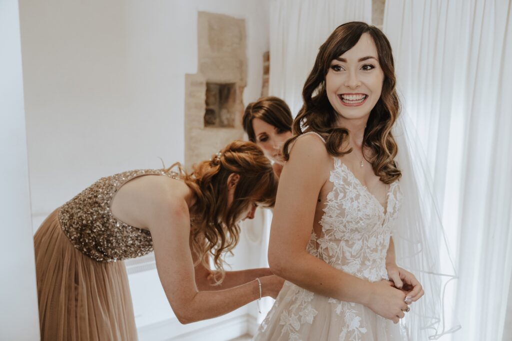 Norfolk wedding photographer capturing a bride getting ready at Pentney Abbey in Norfolk