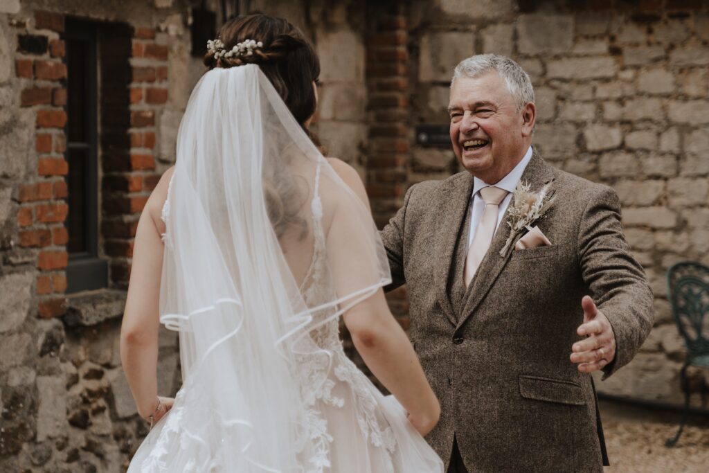 The bride having a first look with her father at Pentney Abbey in Norfolk